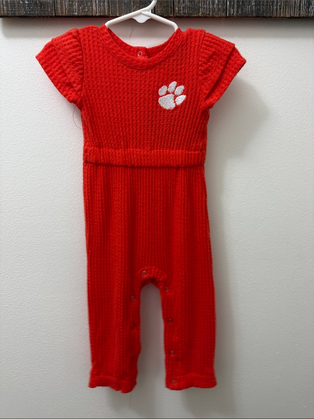 Colosseum orange Knit Baby One-Piece with White Paw